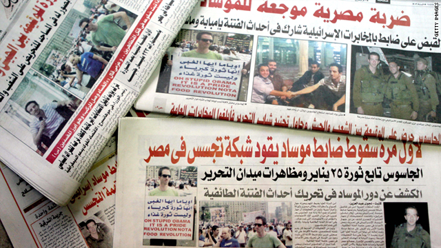 Ilan Grapel, a U.S.-Israeli ciziten arrested June 12 on suspicion of spying, is pictured on Egyptian newspapers dated June 13.