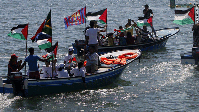 Palestinians ride on boats at the port of Gaza City during a rally in support of the Gaza-bound international Freedom Flotilla.