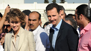 Syrian President Bashar al-Assad (R) and First Lady Asma al-Assad in Damascus on June 30, 2011