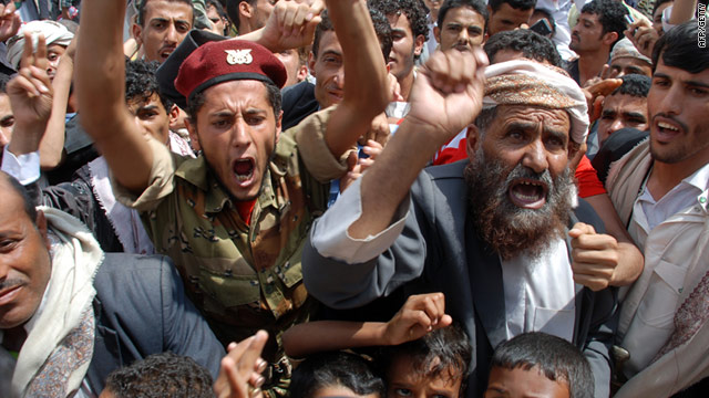 Yemeni anti-government protesters shout slogans during a rally in Sanaa on July 8.