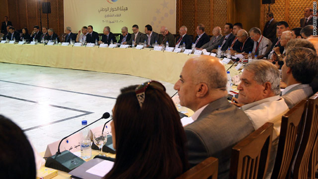 Syrian officials and delegates attend the national dialogue meeting in Damascus on July 10, 2011.