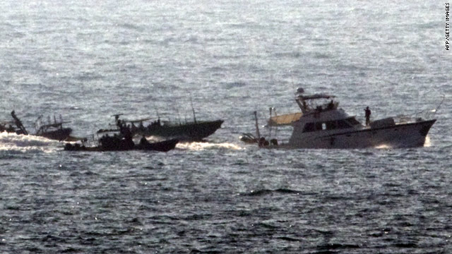 Dignite enters the Israeli port of Ashdod flanked by Israeli naval vessels after being intercepted in international waters