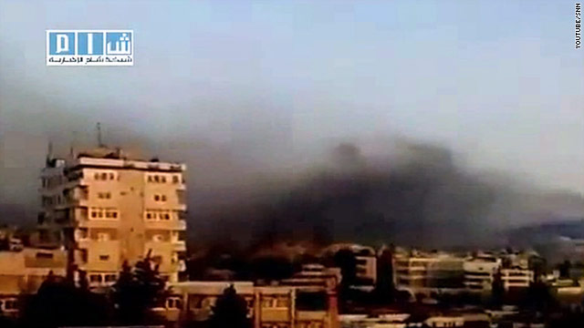 Smoke over Hama, Syria, Sunday: human rights activists say residents have taken to the streets after tanks entered the city.