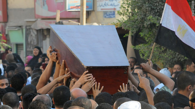 Mourners carry the coffin of one of the security officers killed along the Egypt-Israel border.