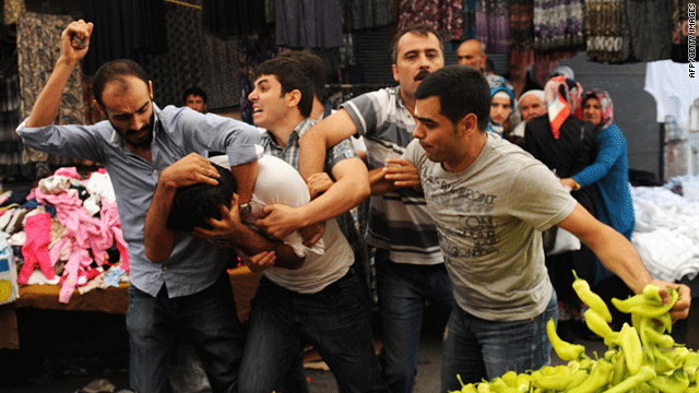 Turkish plainclothes police hold a pro-Kurdish protester during a demonstration in Istanbul on Sunday.