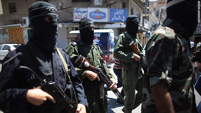 Militants from the Popular Resistance Committee announce a temporary halt to rocket fire into Israel on August 22 in Gaza City.    