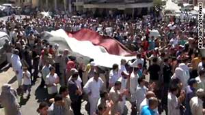 An image grab taken from YouTube shows Syrian anti-government demonstrators in Idlib on August 26, 2011.