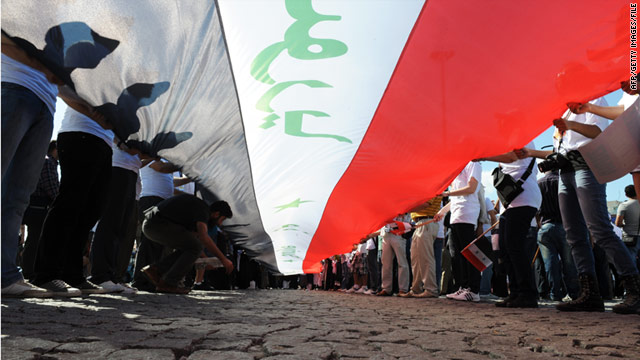 People hold a huge Syrian flag at a protest against the regime of President Bashar al-Assad in Istanbul, Turkey, on August 28.