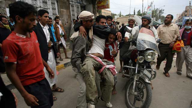A Yemeni protester is injured following clashes with government troops outside Sanaa University on September 18, 2011.