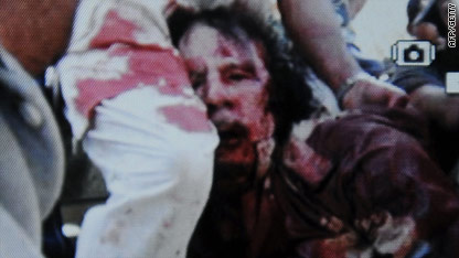 Gadhafi reportedly shot while running from fighters