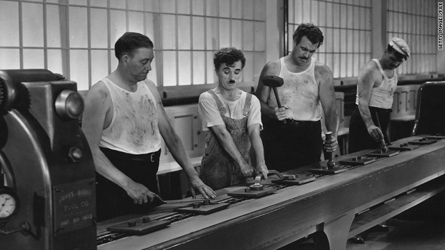 https://i.cdn.turner.com/cnn/2010/OPINION/11/29/zelizer.chaplin.modern.times/t1larg.charlie.chaplin.modern.times.scene.gi.jpg?utm_source=chatgpt.com