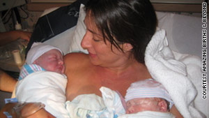 Amber Diez cuddles with her twin babies, Olivia and David Diez, after giving birth.