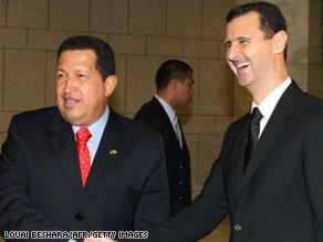 الأسد وشافيز خلال الاجتماع