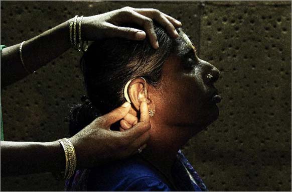 A patient being fitted with a low-cost hearing aid, 2003, Dilip Mehta